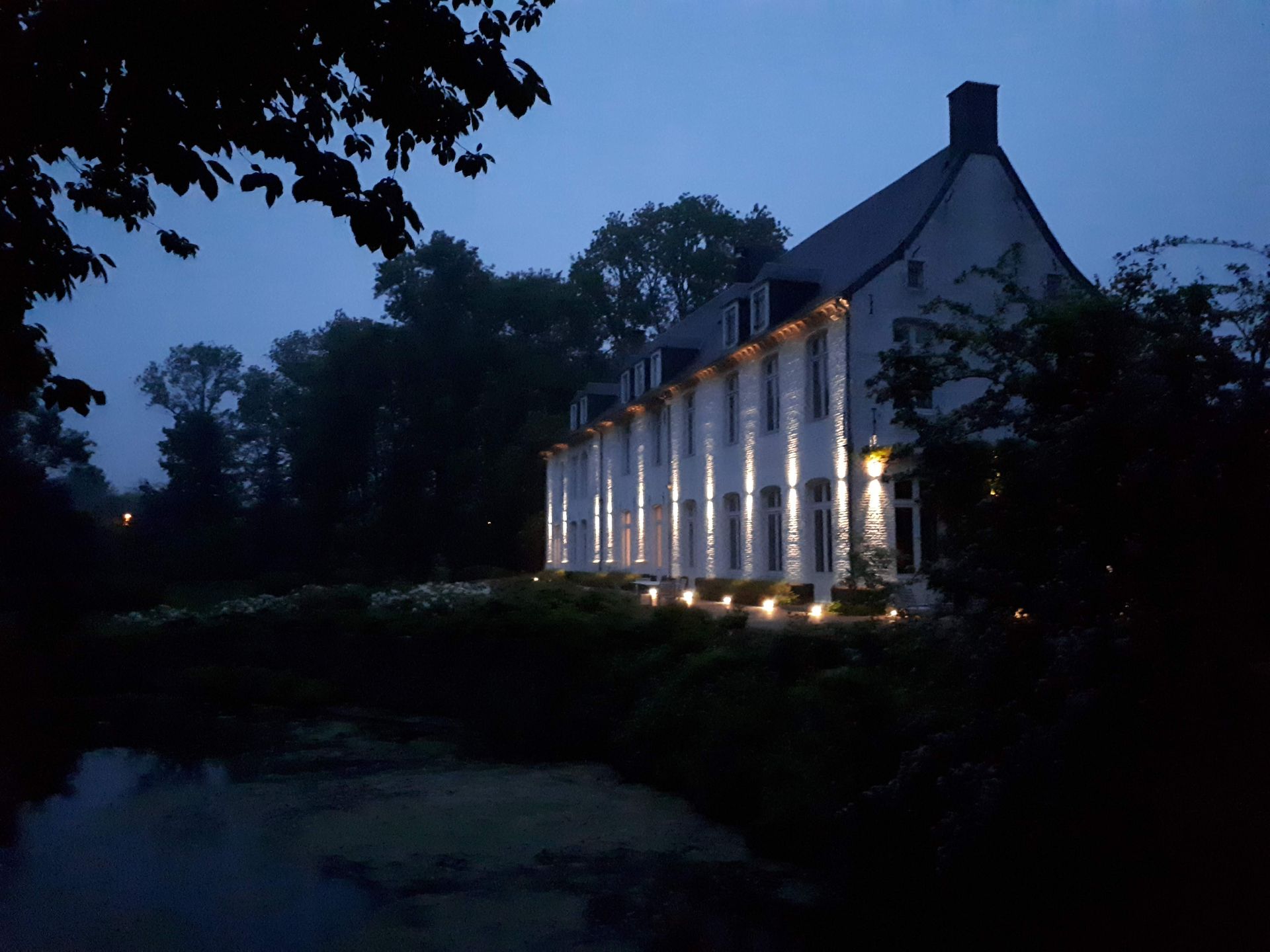 A white façade with columns at the blue hour